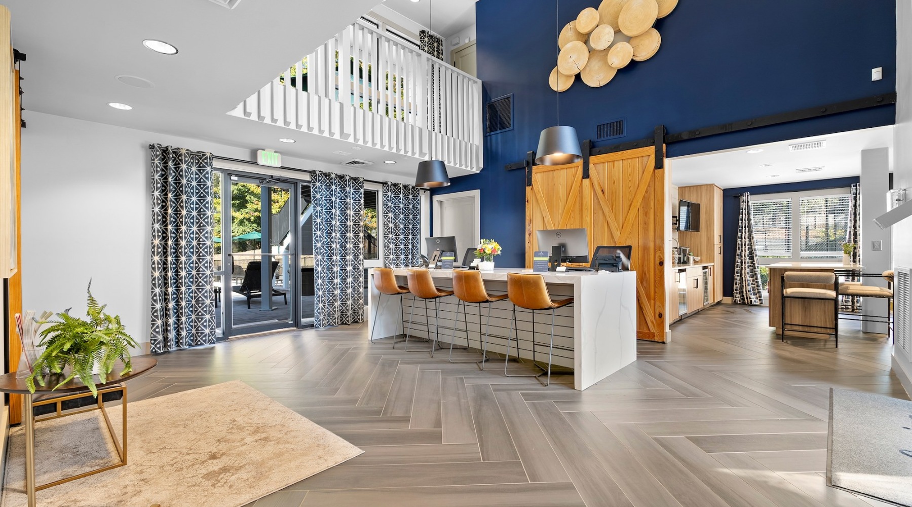 lobby with blue wall seating and wood sliding doors