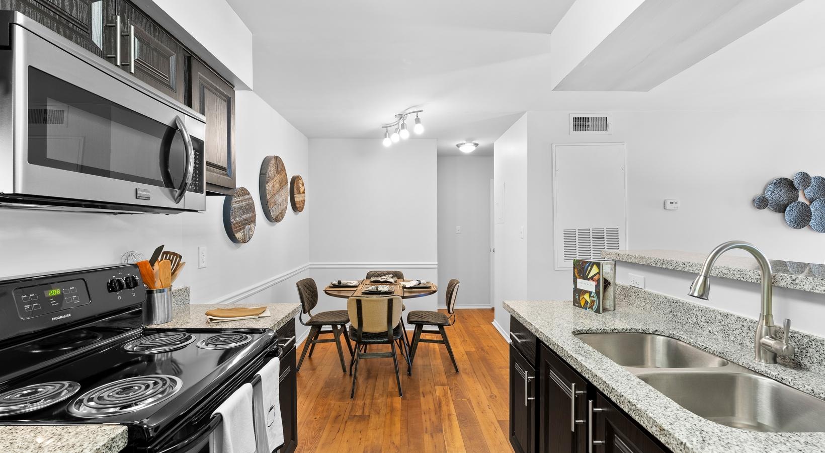 a kitchen with a table and chairs