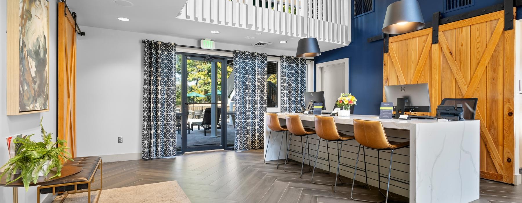 a room with a bar and chairs